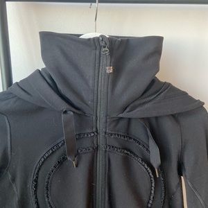 Lululemon black long zip up. Zips from the top or bottom. Size 8.